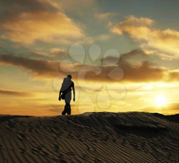 Royalty Free Photo of a Silhouette of a Hiker in the Desert