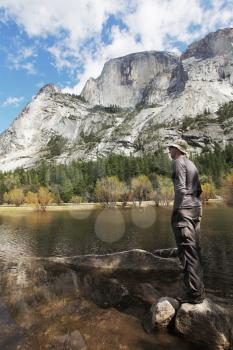Royalty Free Photo of a Man Looking at a Lake in Yosemite