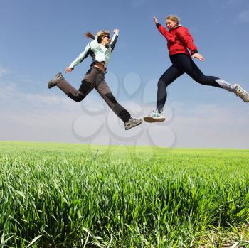 Royalty Free Photo of Two Women Jumping