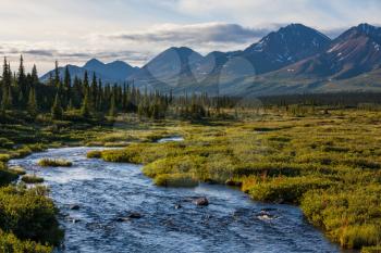 Royalty Free Photo of a River, Tundra and Mountains in Alaska