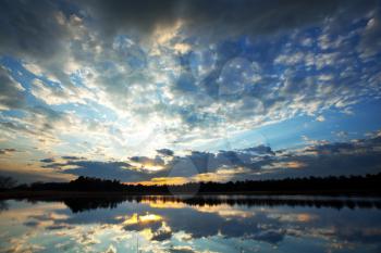 Royalty Free Photo of a Sunrise Scene on a Lake