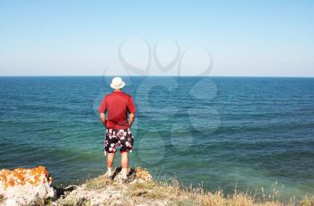 Royalty Free Photo of a Man Looking at the Ocean
