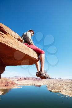 Royalty Free Photo of a Man on a Cliff