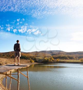 Royalty Free Photo of a Man at a Mountain Lake