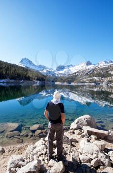 Royalty Free Photo of a Man Standing at a Mountain Lake