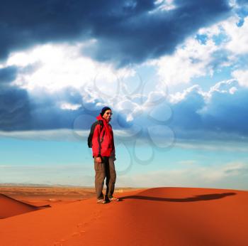 Royalty Free Photo of a Hiker in the Desert