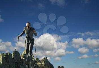 Royalty Free Photo of a Man Hiking on Rocks