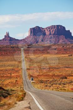 Royalty Free Photo of a Road Through Monument Valley in Utah, USA