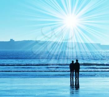 Royalty Free Photo of a Silhouette of a Couple on the Sea Coast