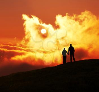 Royalty Free Photo of a Silhouette of a Couple at Sunset