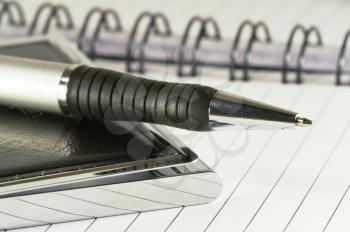 Royalty Free Photo of a Pen Laying on a Book