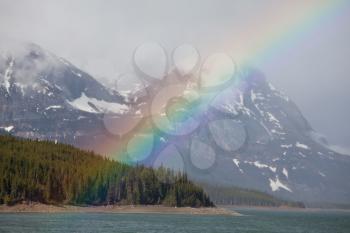 Royalty Free Photo of a Rainbow in the Mountains