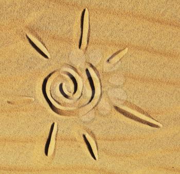 Royalty Free Photo of a Sun Drawn in the Sand