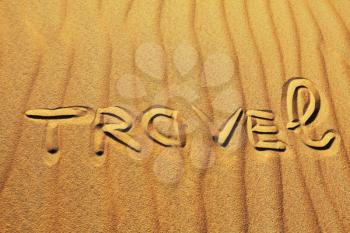 Royalty Free Photo of the Word Travel Written in the Sand