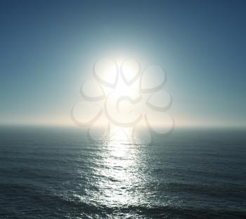 Royalty Free Photo of the Sun Over Water