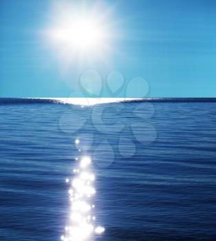Royalty Free Photo of the Sun Sparkling on Water