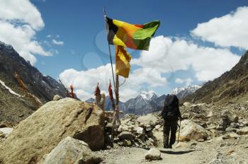 Royalty Free Photo of a Hiker and Flags
