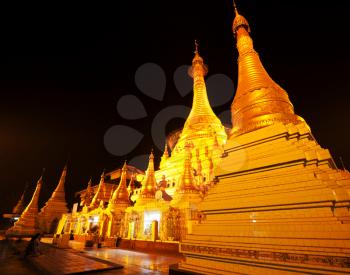 Royalty Free Photo of Shwedagon Golden Pagoda at Night in Yangon, Myanmar