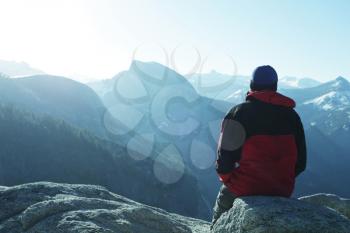 Royalty Free Photo of a Man looking out over Yosemite National Park