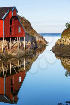 Red wooden fishing cabins in   Norway