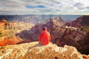 Traveler on cliff mountains over Grand Canyon National Park, Arizona, USA.Inspiring emotion. Travel Lifestyle journey success motivation concept adventure  vacations outdoor concept. 