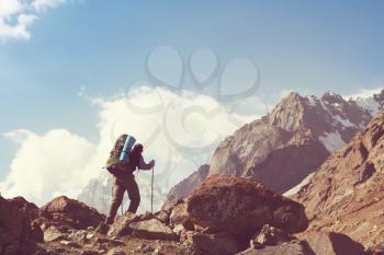 Backpacker in high beautiful mountains