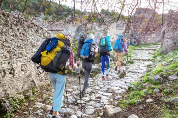 Group of backpackers hiking in mountains outdoor active lifestyle travel adventure vacations journey  freedom Summer landscape Hike concept