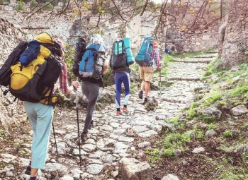 Group of backpackers hiking in mountains outdoor active lifestyle travel adventure vacations journey  freedom Summer landscape Hike concept