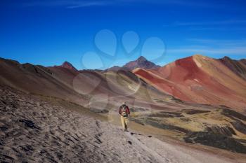 Hiking scene in Vinicunca, Cusco Region, Peru. Montana de Siete Colores,  Rainbow Mountain.