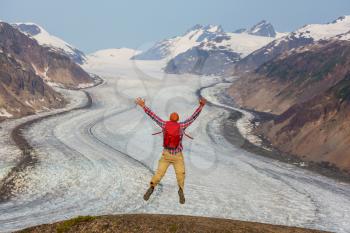 Jumping man above Salmon glacier, Canada