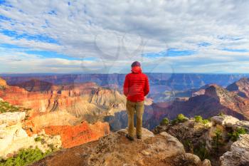 Traveler on cliff mountains over Grand Canyon National Park, Arizona, USA.Inspiring emotion. Travel Lifestyle journey success motivation concept adventure  vacations outdoor concept.