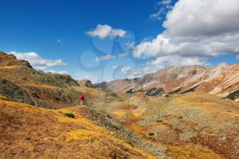 Man hiking in the Rocky mountains, Colorado in autumn season