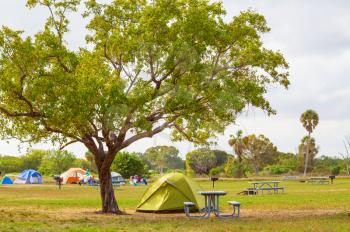 Tents in the camping in green meadow, Florida, USA