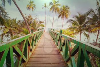 Wooden boardwalk on the tropical beach in Costa Rica, Central America