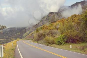 Scenic road in the mountains. Travel background.