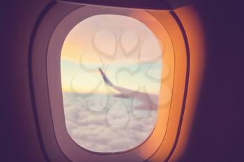 Window in the aircraft cabin. Travel background.