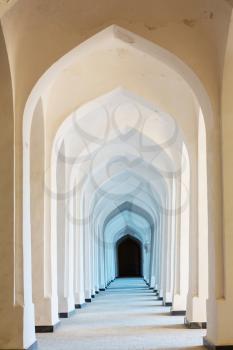 White Arabian arches in Kolon mosque. Bukhara. Uzbekistan. Central Asia.