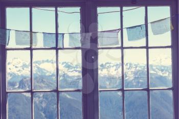 Wooden window with summer mountains. Wanderlust travel concept.
