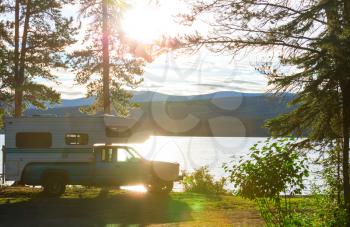 Camping car in recreation site at sunrise