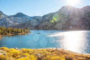 Beautiful nature scene in autumn mountains. Sierra Nevada lake reflection.