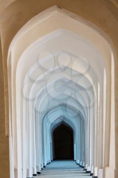 White Arabian arches in Kolon mosque. Bukhara. Uzbekistan. Central Asia.