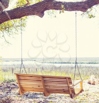 Wooden swing on the beach