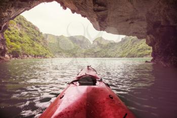 Canoe exploring caves in Ha Long Bay,Vietnam