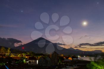 Volcano Agung and Amed beach, Bali, Indonesia at night 