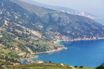 Beautiful rocky coastline in Greece. Sea, green hills, beautiful landscapes