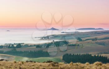 Amazing foggy rural landscapes at morning. New Zealand beautiful nature