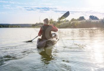 kayaking in river in the summer season