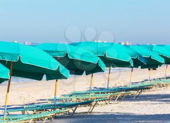 Luxury chairs on a sandy beach in ocean coast. Holiday and vacation concept. Tropical beach.