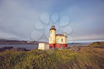 a lighthouse on a picturesque seashore