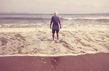 Man on oceanic beach